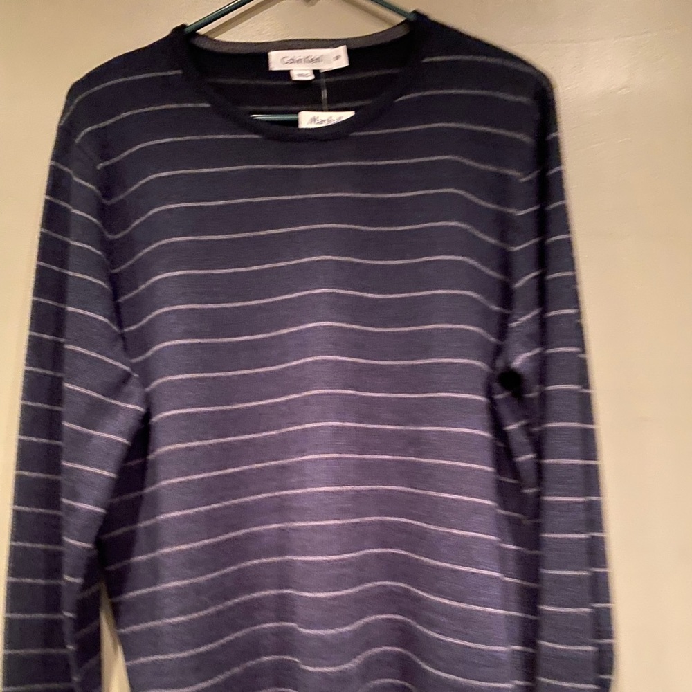 New with tags Men’s pull over striped sweater by Calvin Klein size small/petite.